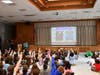 Students guessing who the masked reader is.