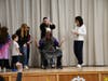 Principal Dr. James Foy being turned into a human sundae.