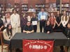 Ava Romonoyske and Sean Grossman flanked by members of the Earl L. Vandermeulen High School Tri-M Music Honor Society