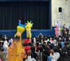 Teachers at Robert W. Carbonaro School woreelaborate costumes to mask their identities and read beloved stories tostudents during an exciting event inspired by the popular game show The Masked Singer.