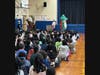 Teachers at Robert W. Carbonaro School woreelaborate costumes to mask their identities and read beloved stories tostudents during an exciting event inspired by the popular game show The Masked Singer.