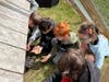 Tremont Elementary School students engage in hands-on activities feeding animals.