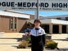 Patchogue-Medford High School senior Colin Jennings helps enhance the school’s main entrance.