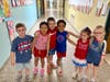 Riley Avenue Elementary School students don red, white, and blue in honor of Flag Day.
