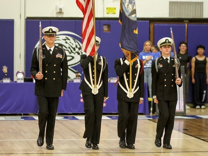 Kaleb Gatto, far right, leads his fellow Riverhead High School NJROTC members at a district event.