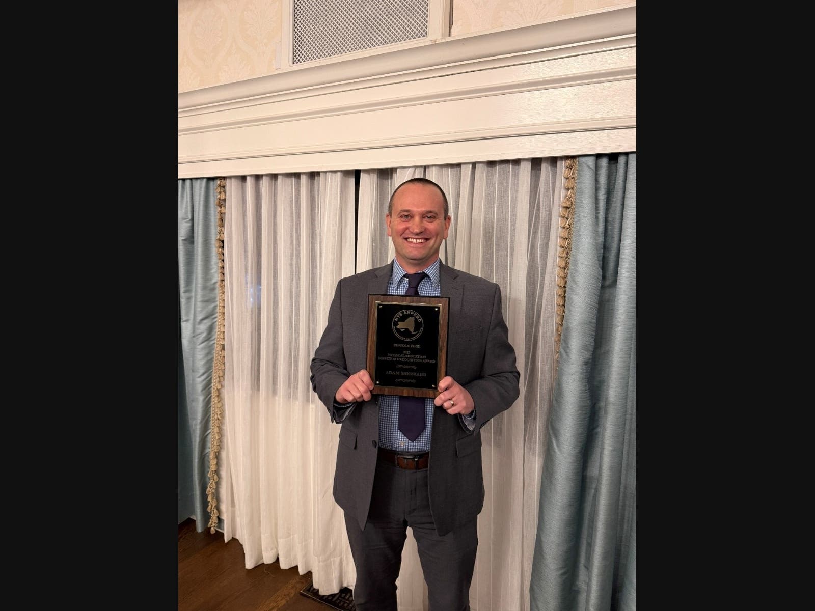 Adam Sherrard is awarded the 2025 Physical Education Director of the Year Award for the Suffolk County Chapter of the New York State Association of Health, Physical Education, Recreation and Dance.