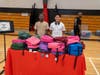 Uniondale School District students distribute free backpacks and school supplies.