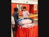 A Uniondale student excitedly browses backpacks at the back-to-school drive.