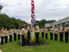 Westbury High School NJROTC cadets lower the American flag to half-staff in honor of 9/11.