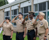 The Westbury High School NJROTC salutes the flag.