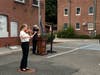 Earl L. Vandermeulen High School senior Ava Sexton performs at the Port Jefferson Fire Department memorial service.