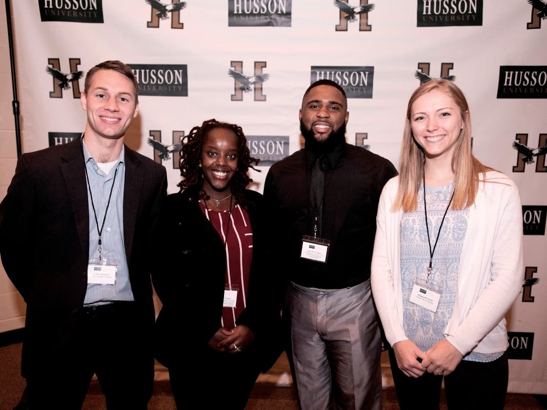 (From left to right) Joshua Bellomo, Aline Gwiza, Jean W. St. Simon, and Shanna M. Porter were just some of the nearly 100 students who attended Husson University's 2018 Women's Philanthropy Scholarship Luncheon.