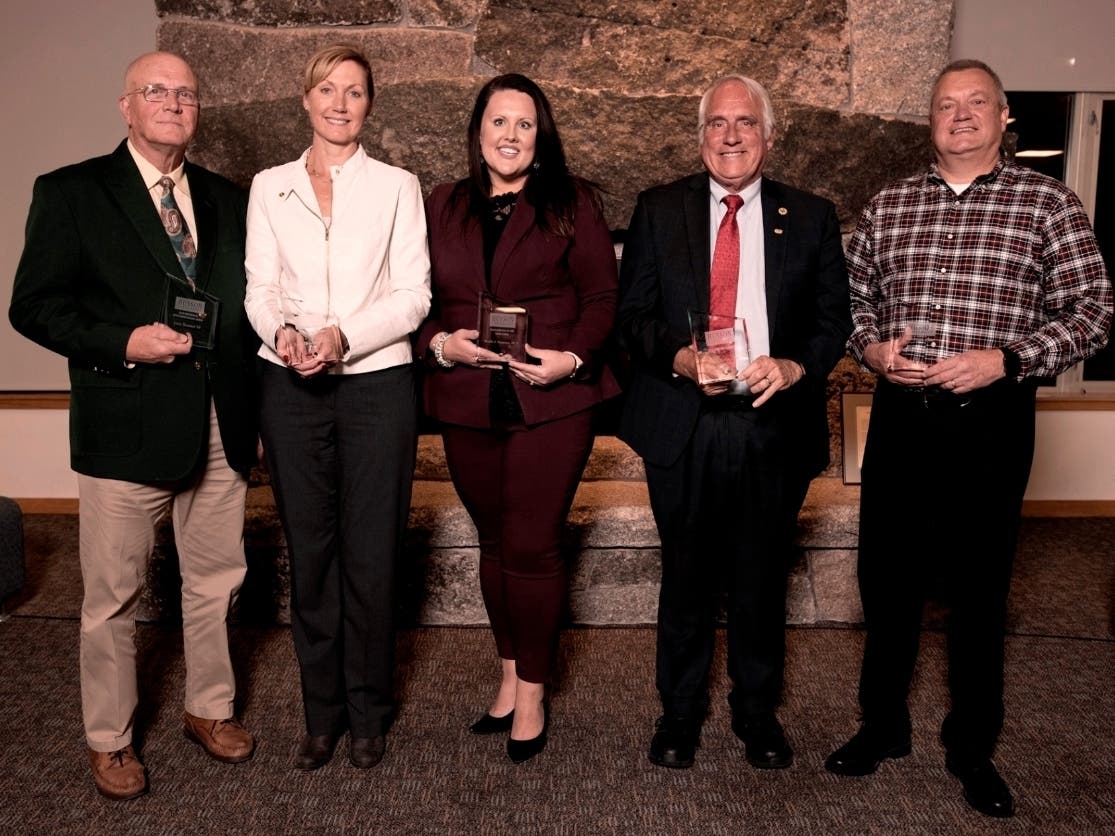 The five individuals honored at this year's Husson University Alumni Hall of Fame ceremony were (from left to right): Larry Homsted, '64; Karen F. Clements, RN, '04 (G); Michelle Osgood Montgomery, DO, '11; Dewey Martin, '19; and Albert W. Allen, '86.