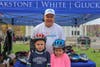 Attorney David W. White with children who received free helmets from Breakstone, White & Gluck's Project KidSafe.