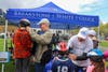 Bill Hanson, former chair of the Framingham Bicycle & Pedestrian Advisory Com and Attorney David W. White fit helmets.