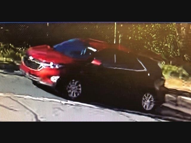 The suspect's vehicle is described as a red, newer model Chevrolet SUV with tinted rear windows, no front license plate and a temporary rear plate, according to police. 