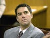Scott Peterson (L) listens to prosecutor Joseph Distaso respond to defense attorney Mark Geragos’ petition for dismissing double murder charges against Peterson January 14, 2004 in Modesto.