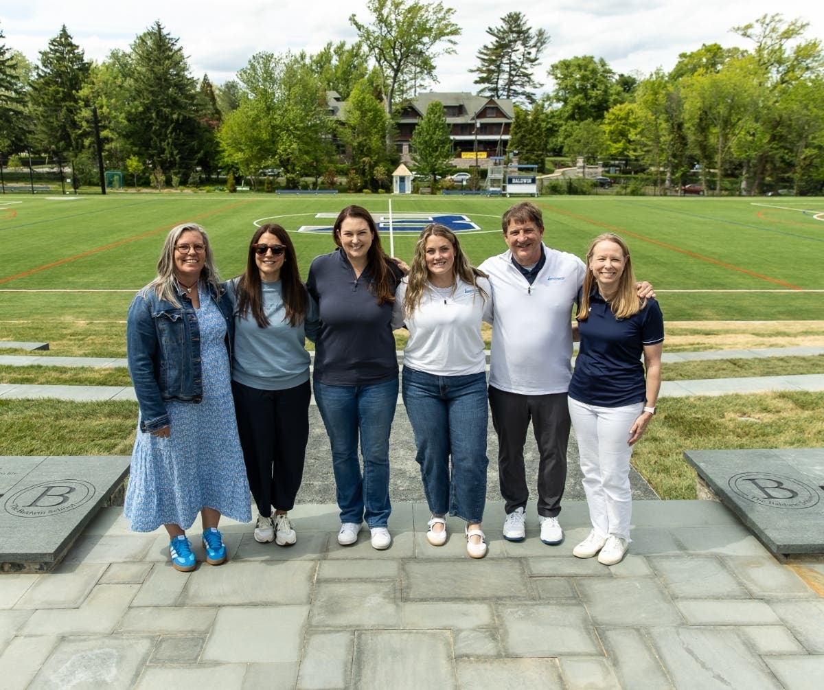 Baldwin Director of Athletics Meg Glascott-Birch and Head of School Lynne Macziewski gather with Longstreth team members to celebrate the “Grow the Game” initiative.