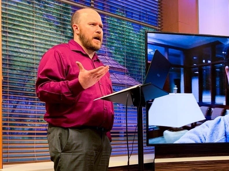 Chris Taydus, manager of the Riderwood TV studio, hosts “Riderwood TV Live” featuring residents and staff via Zoom.