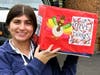 Mount senior Maya Tanella holds up a decorated box for the Food Drive.