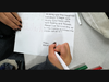 A Mount student writes a heartfelt message on a card for the Operation Smile project.