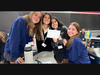 From left, MSDA freshmen Annabel Doyle, Zerrina Campagna, Faye Alquaisy, and Anna Jagen pose with one of the cards they made for Operation Smile.