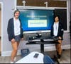 Mount St. Dominic Academy Operation Smile Club Co-Presidents Reese Falcone '26 and Hope O'Connor '26 explain the card-writing event to club members.