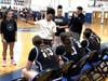 Mount St. Dominic acting head coach Kyla Ramseur (center) talks to her team between quarters against Montclair in the Essex County Tournament first round contest. The Lions defeated Montclair, 58-23, at home in Caldwell on Jan. 31. 