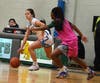 Mount St. Dominic sophomore Izzy DeLorenzo (left) looks to get by Arts Harmoni Burgess. The Lions lost a heartbreaker at Arts, 40-37, in the ECT quarterfinals on Feb. 7 in Newark. 
