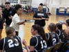 Mount St. Dominic acting head coach Kyla Ramseur (center) talks to her team during a contest with Montclair. Ramseur leads her team into the state playoffs as the fifth seed in the Non-Public A North state section this season. 
