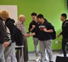 Holocaust survivor Fred Heyman and sophomores Spencer Carus, Zach Boyer, and Ken Shimabuku.