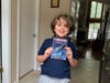 Luca Donnini selected the book “I Survived Hurricane Katrina,” from Cedar Hill’s new book vending machine. Following the ribbon-cutting ceremony, Superintendent Dr. René Rovtar delivered the book his home. Donnini is a 2020 100% virtual student.