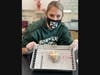 Anatomy & Physiology teacher Jaclynn Hinz of Montville Township High School prepares to assist Montville Township High School students in the dissection of a sheep’s heart. 