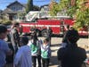 Central County firefighters greet participants at the Farringdon Lane drill.