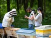 Pace students Brian McDermott (center) and Emily Arrieta with beekeeper Adrienne Lavalle from Apiary 16 in Milan, N.Y.