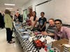 Selling food with their team at a chess tournament