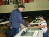 Ethan Gagliano teaching chess to seniors