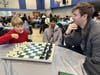 Jack, Krish and Chris playing chess at the ex prisoner lunch in Chicago.