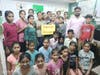 Children thanking Jack Weed for a new computer