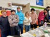 Zein with her teenage volunteers at a chess tournament