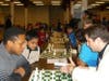 BJ Armstrong playing GM Shulman at a chess fundraiser where Zein served Hummus for charity