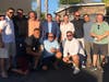 Former sheriff's deputy Robert Pequeno (blue shirt, jacket) and his neighbors posed for this mask-free photo at his launch party, a day in which 2,010 Americans died of coronavirus.