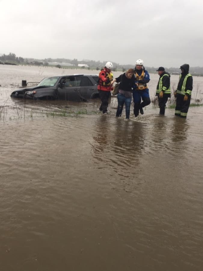 Emergency personnel rescue a driver from flooded Stony Point Road in Petaluma, Feb. 26, 2019.