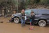 A Guerneville mother and daughter who wished to remain unidentified check on their flooded SUV Friday, March 1, 2019.