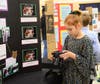 Addelyn Widmer of the Suisun Valley 4-H Club explains camera settings during her photography presentation.