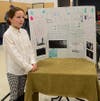 Grace Kemble, Suisun Valley 4-H Club, explains how to “take a perfect picture.” She won gold for her handcrafted display
