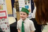Jonny Tiernan-Lang (back) of the Elmira 4-H Club talks about his project, "AKC Toy Breeds."