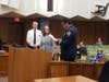 Retired fire Investigator Vic Massenkoff and Chief Jeff Carman present the Carnegie Hero award to Samantha Barnhouse.