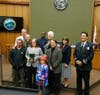 Carnegie Hero Samantha Barnhouse is pictured with her family, Contra Costa County supervisors and fire officials.