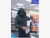 The knife-wielding, masked suspect in at least five armed robberies in Vacaville, CA is shown in a surveillance image.